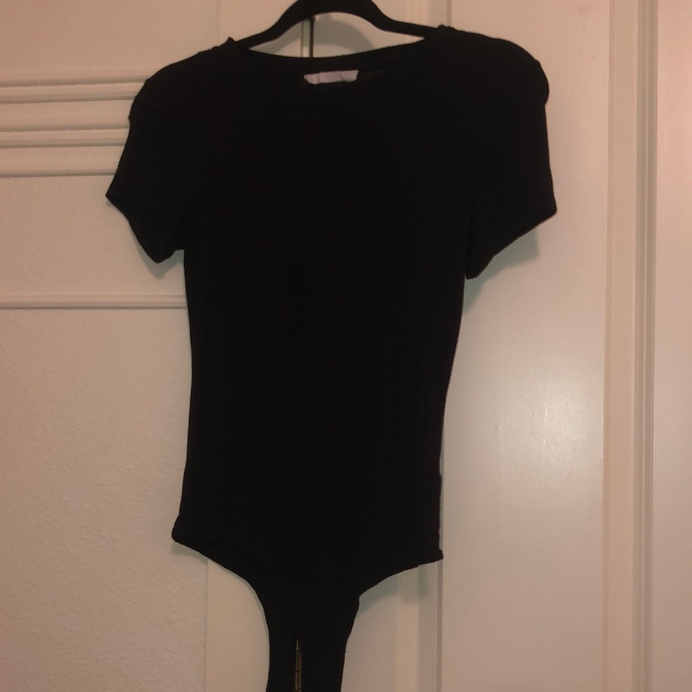 Black body suit from a boutique. Size small.